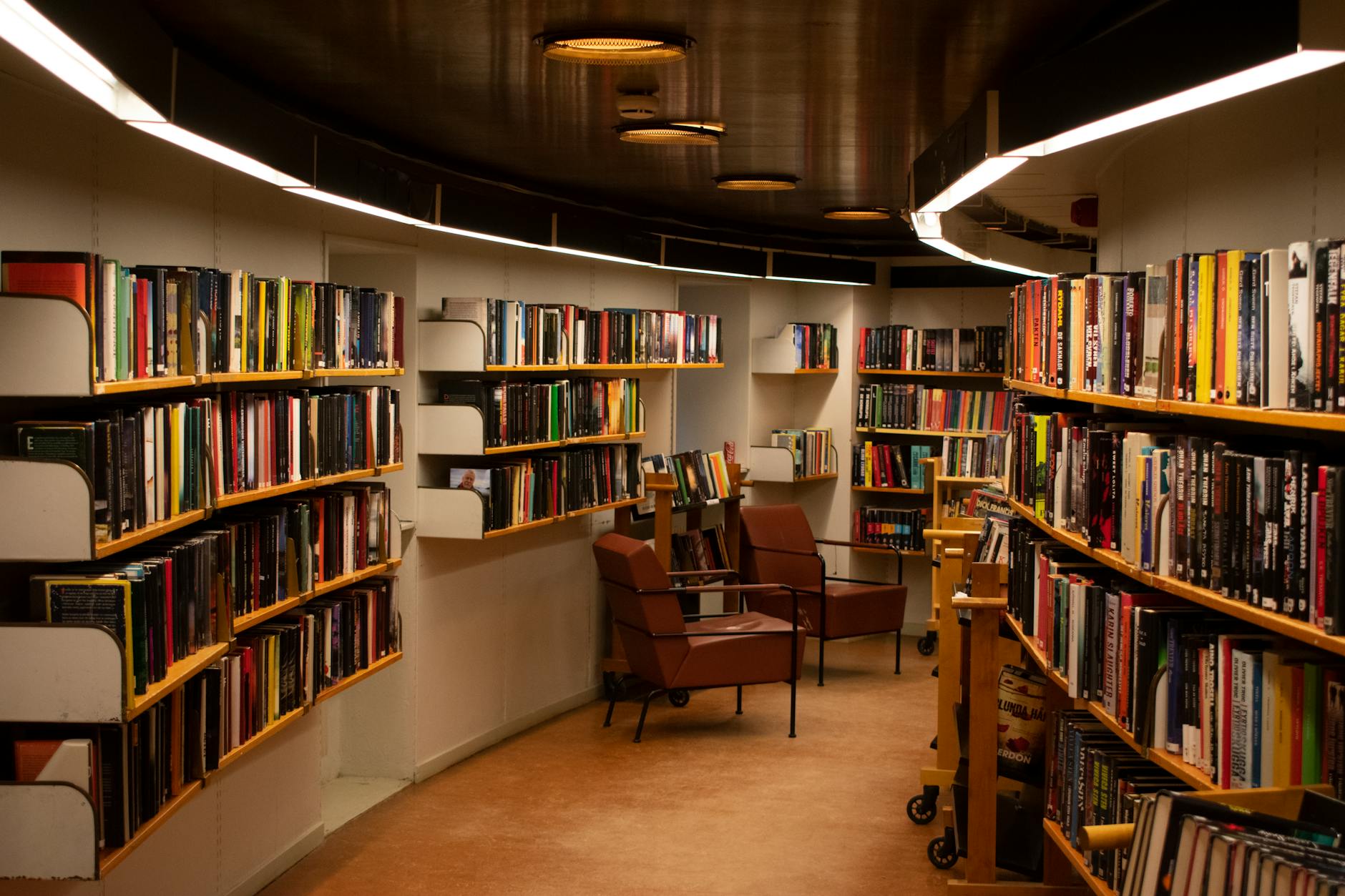 chair beside book shelves